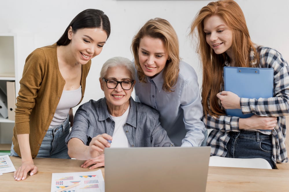 Four Women Engaged in Collaborative Learning